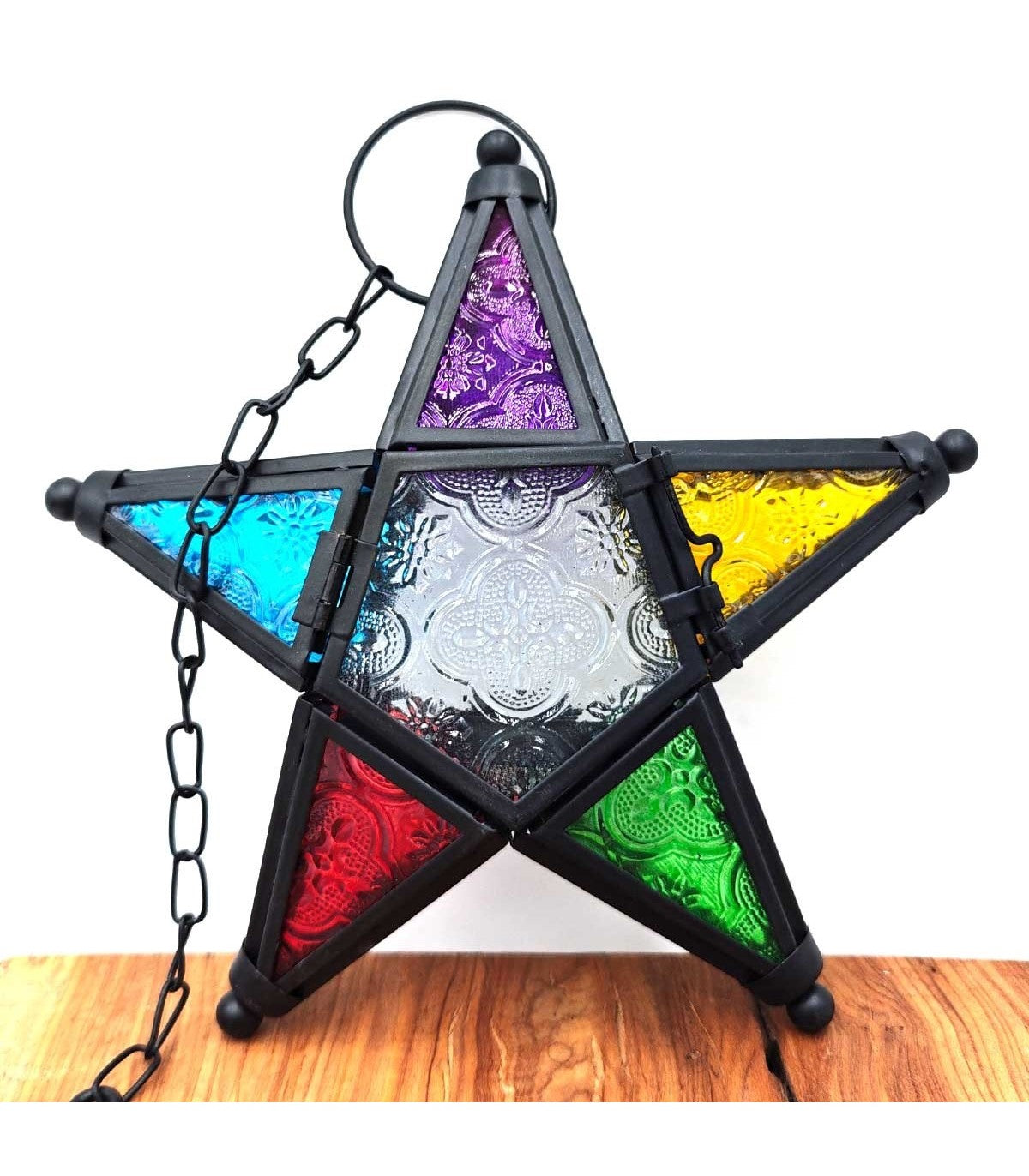 Portavelas estrella Najmati con marco oscuro y paneles morado, azul, amarillo, rojo y verde